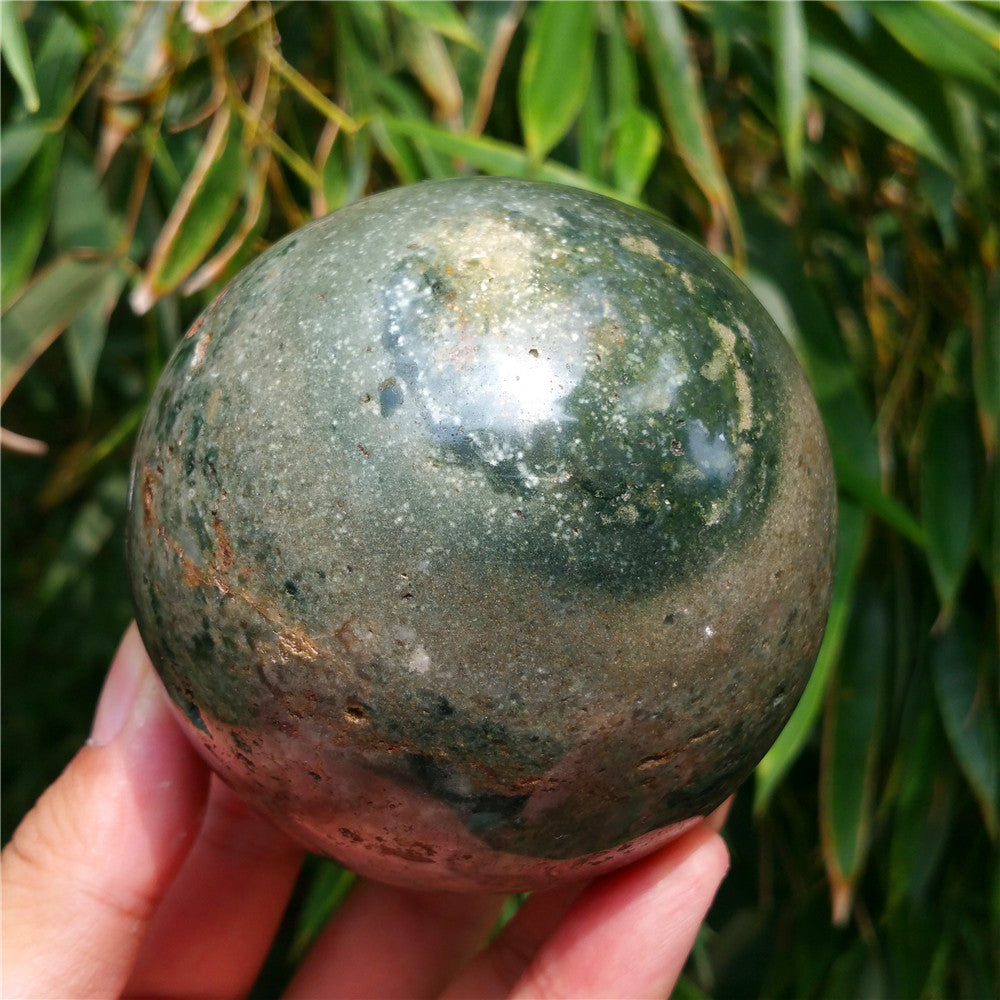Crystal carved ball of Ocean Jasper
