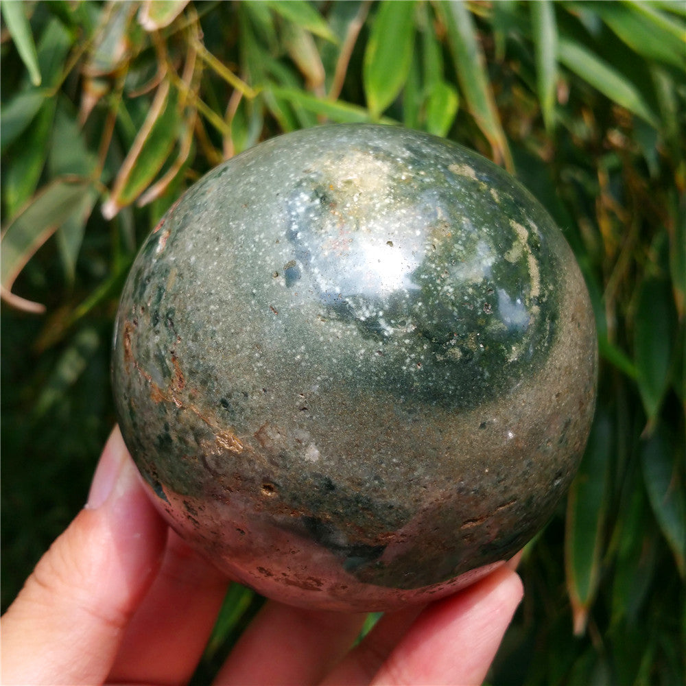Crystal carved ball of Ocean Jasper