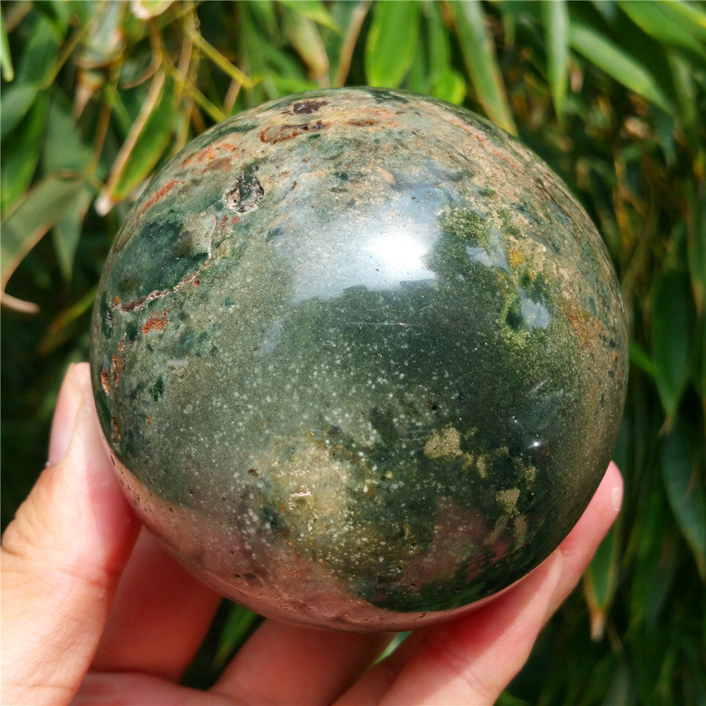 Crystal carved ball of Ocean Jasper