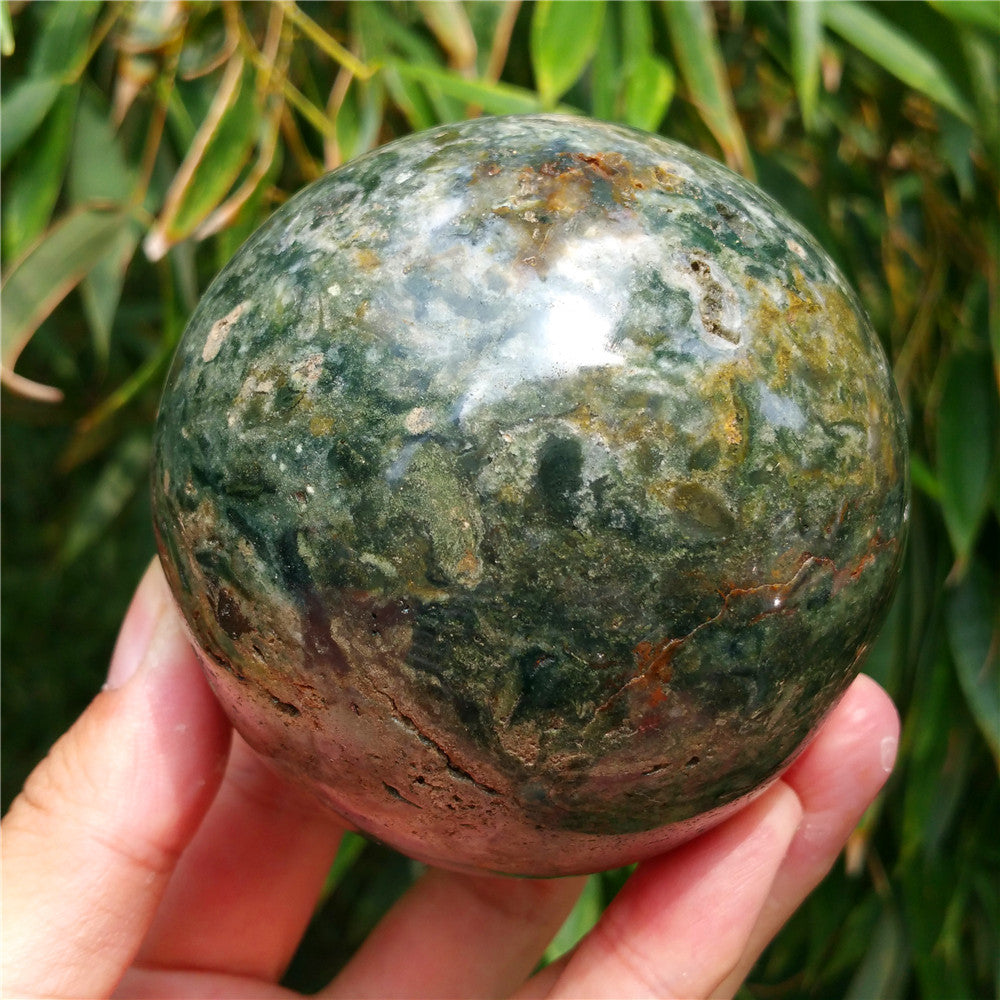 Crystal carved ball of Ocean Jasper