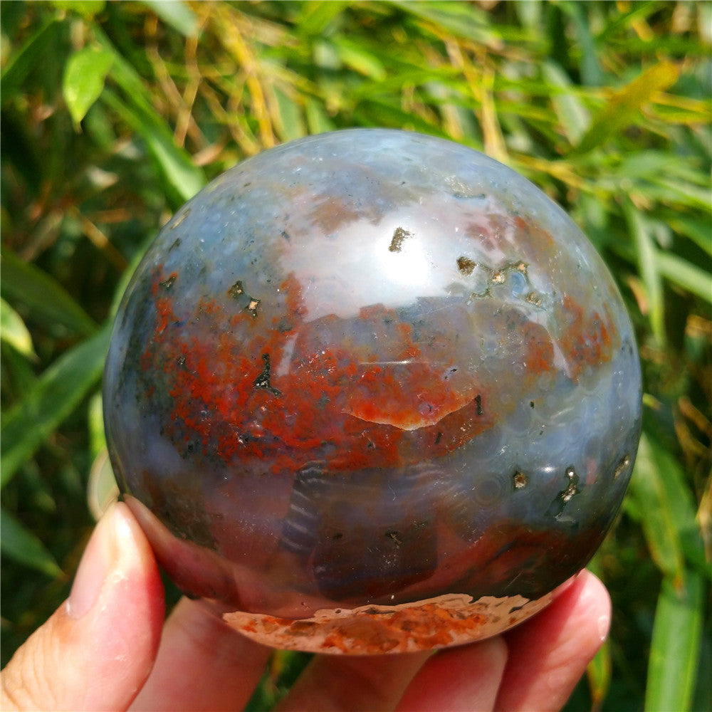 Crystal carved ball of Ocean Jasper