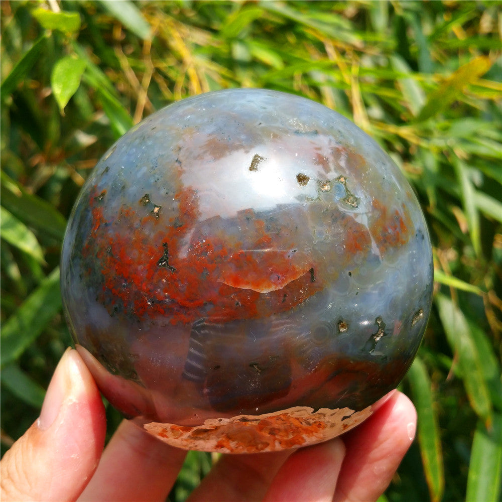 Crystal carved ball of Ocean Jasper
