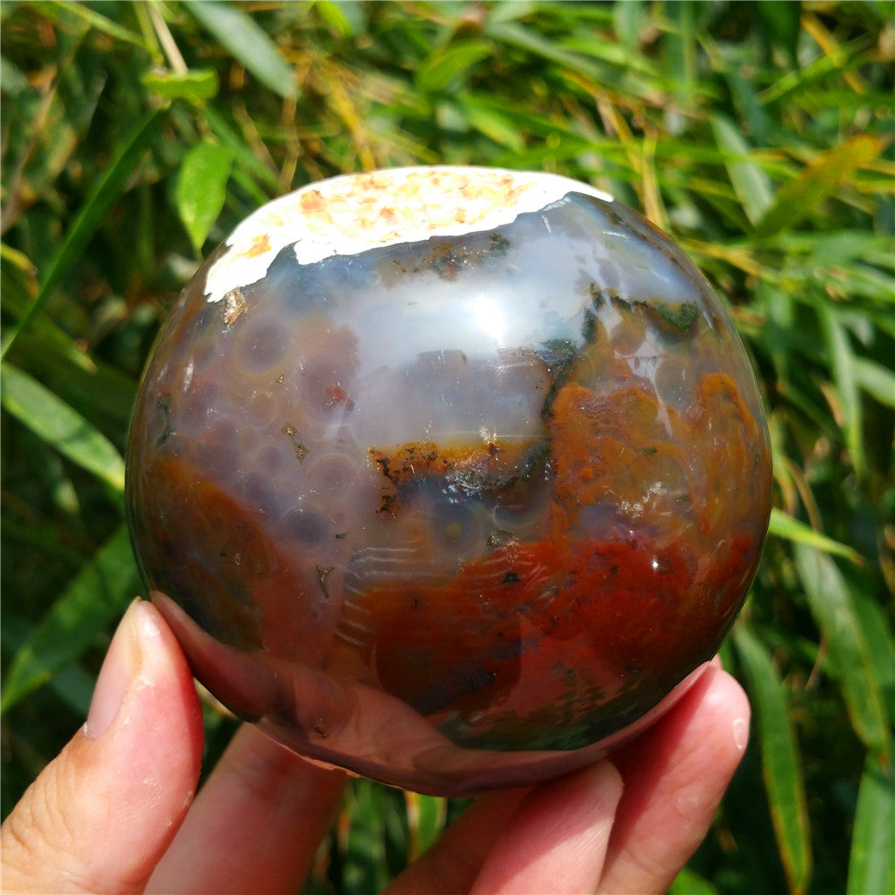 Crystal carved ball of Ocean Jasper