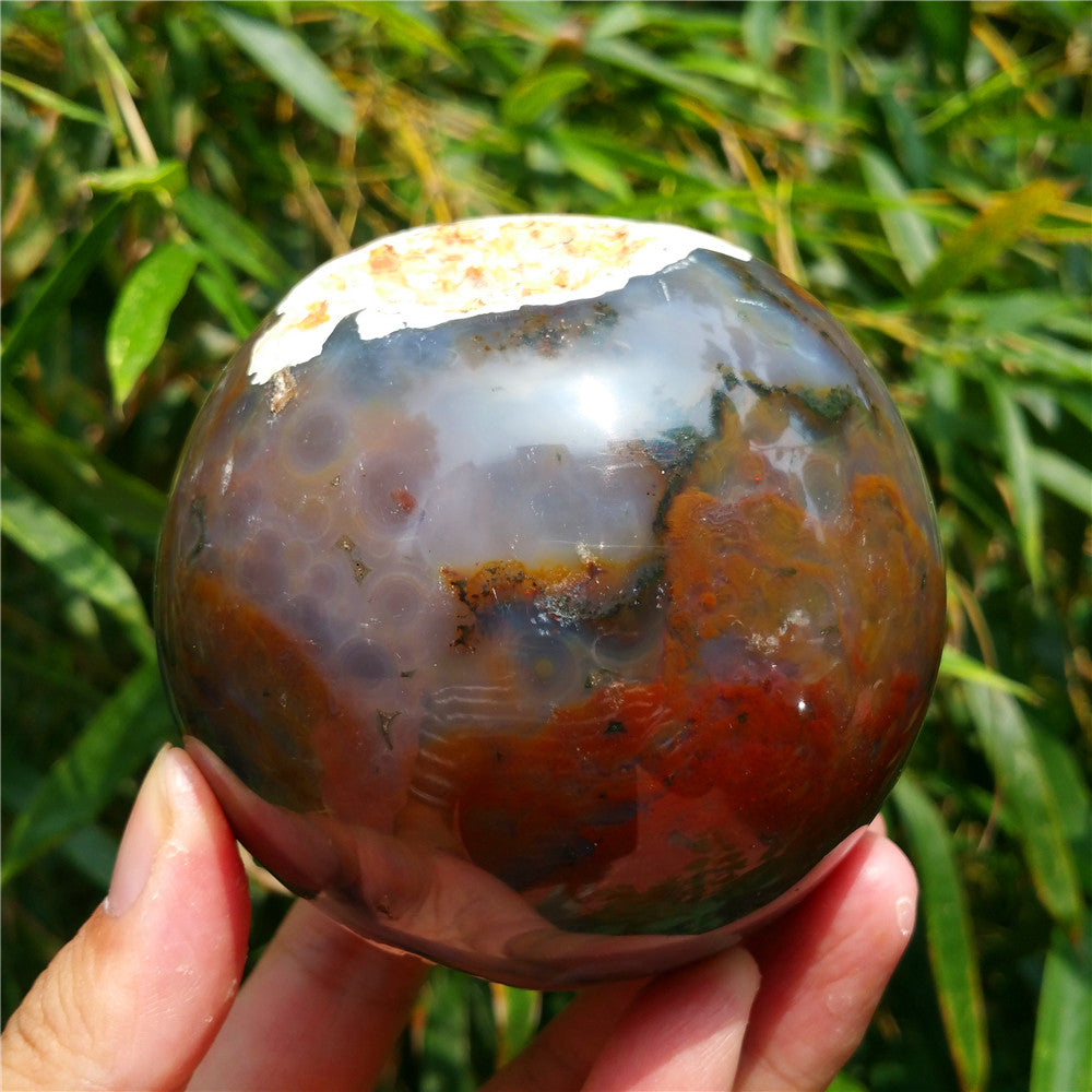 Crystal carved ball of Ocean Jasper