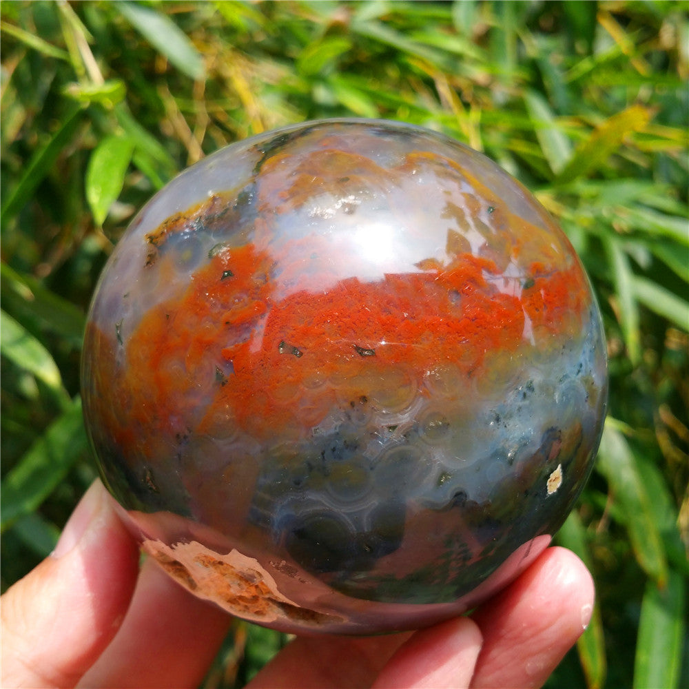 Crystal carved ball of Ocean Jasper