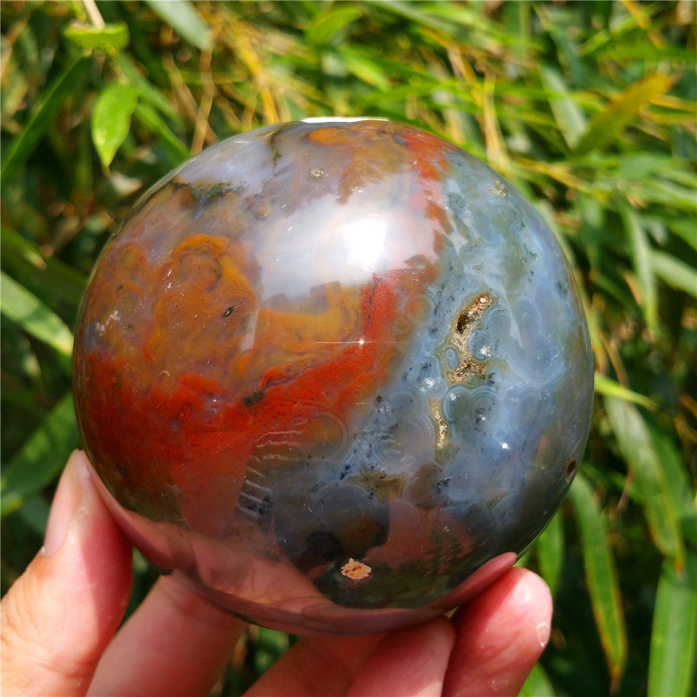 Crystal carved ball of Ocean Jasper