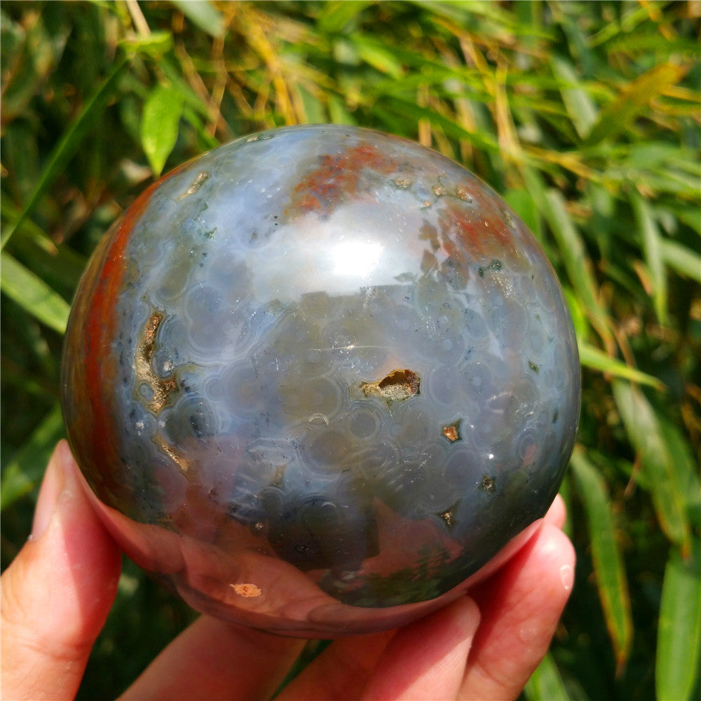 Crystal carved ball of Ocean Jasper
