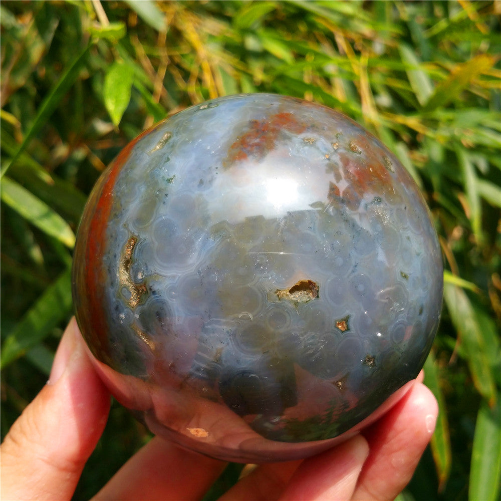 Crystal carved ball of Ocean Jasper