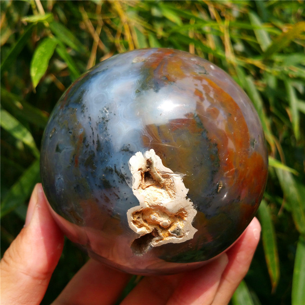 Crystal carved ball of Ocean Jasper