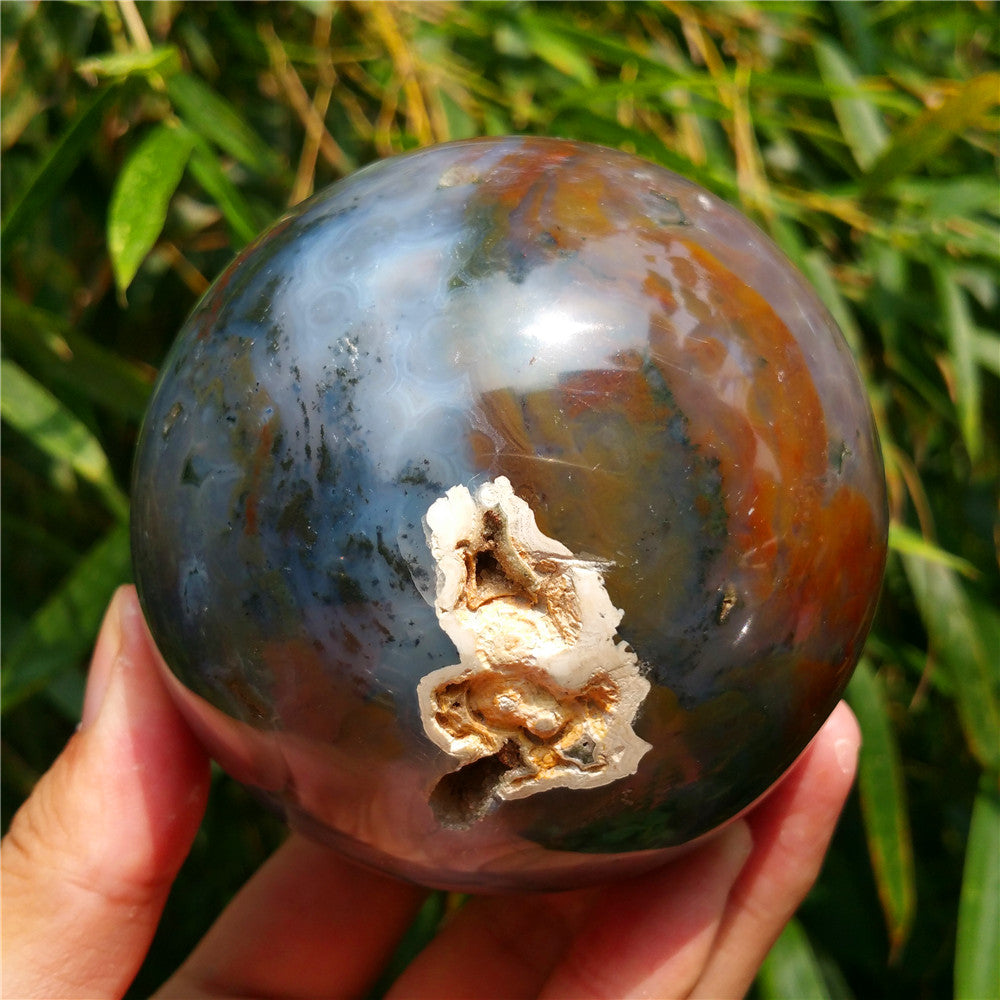 Crystal carved ball of Ocean Jasper