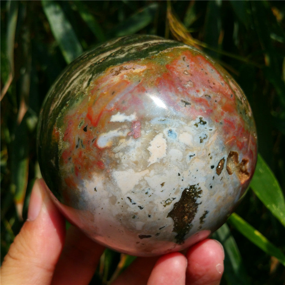 Crystal carved ball of Ocean Jasper