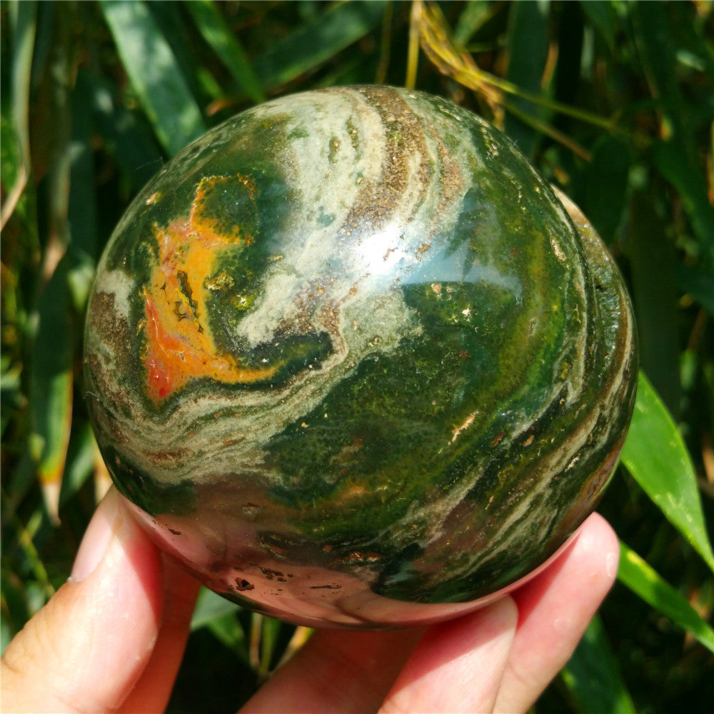 Crystal carved ball of Ocean Jasper