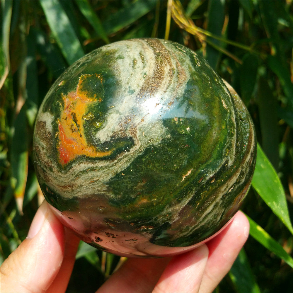 Crystal carved ball of Ocean Jasper