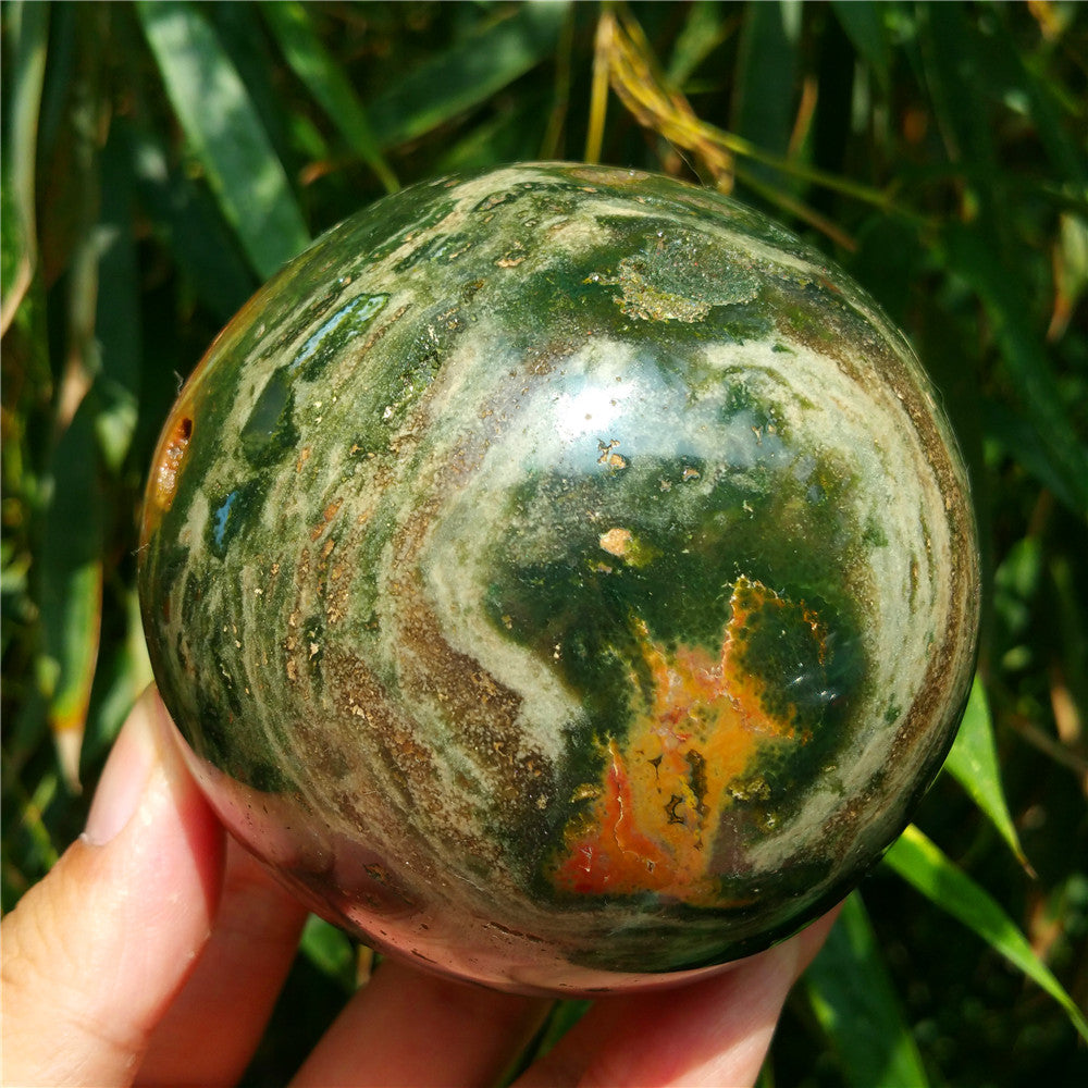 Crystal carved ball of Ocean Jasper