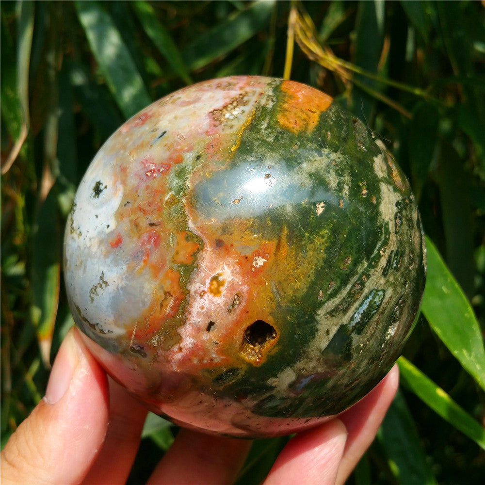 Crystal carved ball of Ocean Jasper