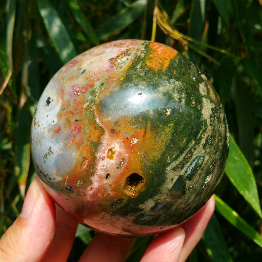 Crystal carved ball of Ocean Jasper