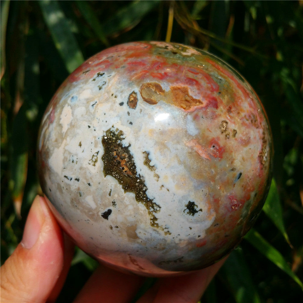 Crystal carved ball of Ocean Jasper