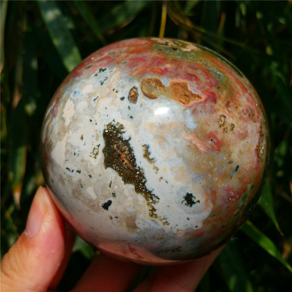 Crystal carved ball of Ocean Jasper