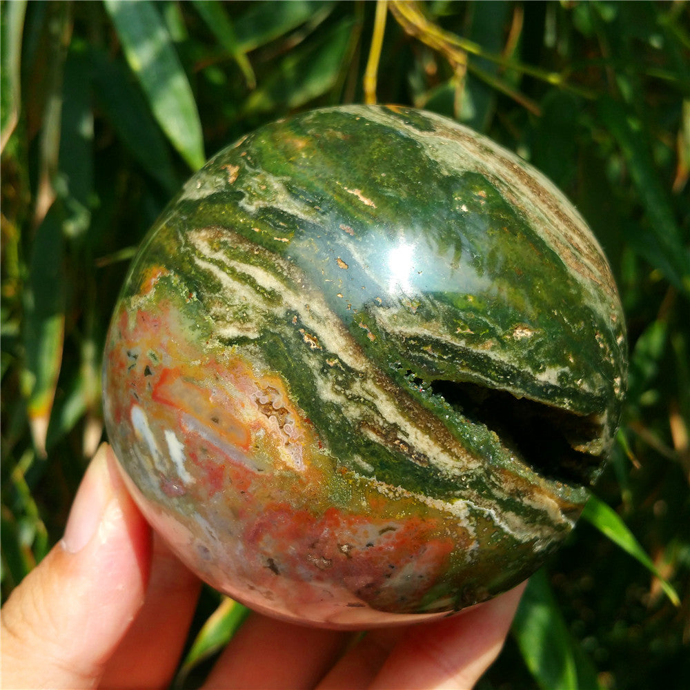 Crystal carved ball of Ocean Jasper
