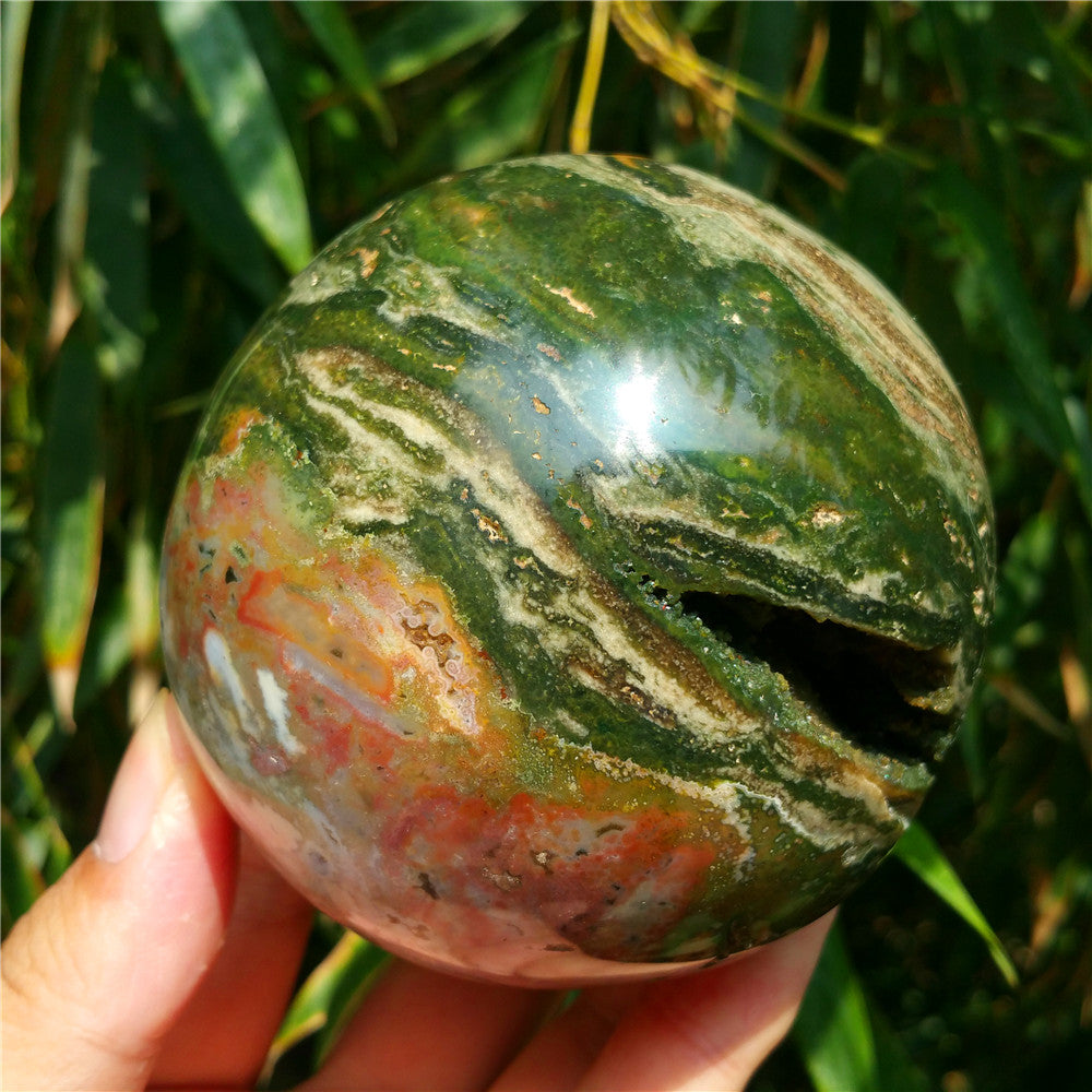 Crystal carved ball of Ocean Jasper