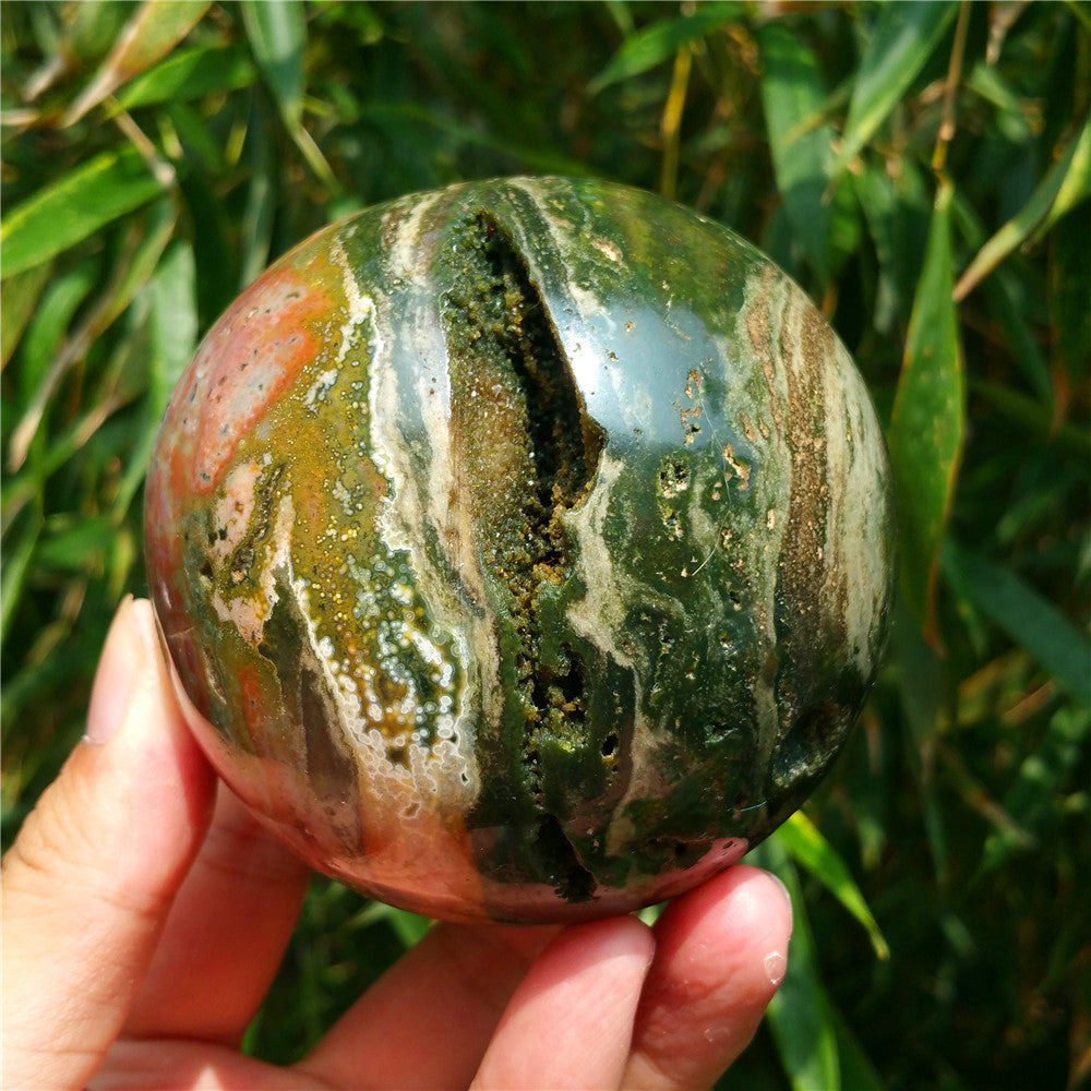 Crystal carved ball of Ocean Jasper