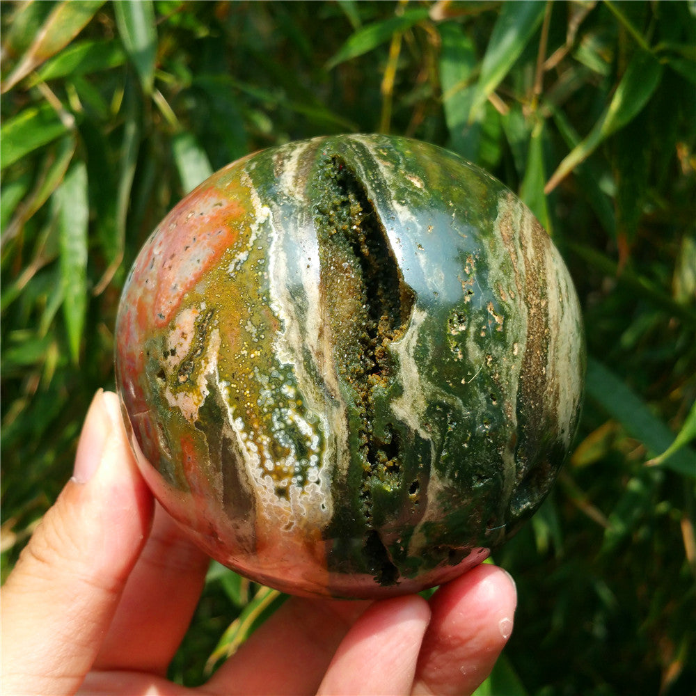 Crystal carved ball of Ocean Jasper