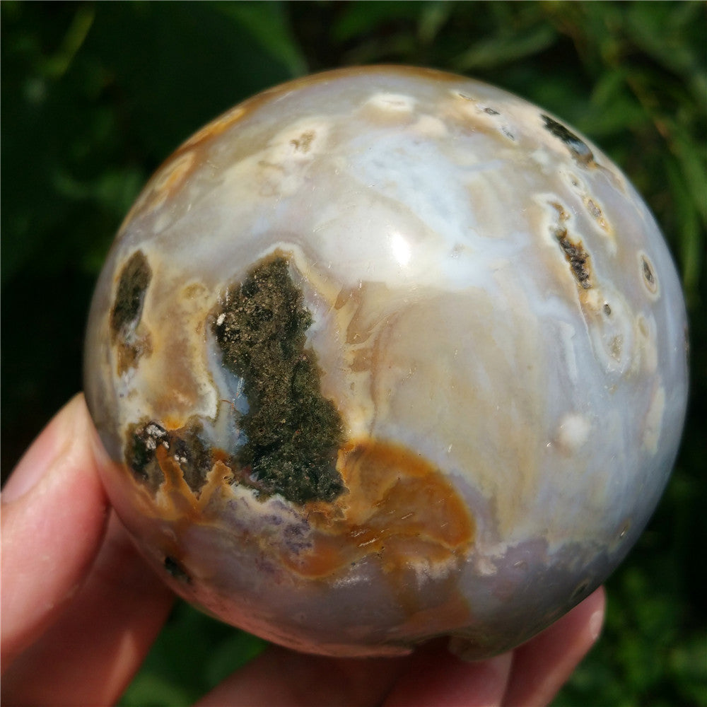 Crystal carved ball of Ocean Jasper