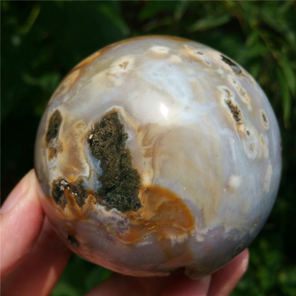 Crystal carved ball of Ocean Jasper