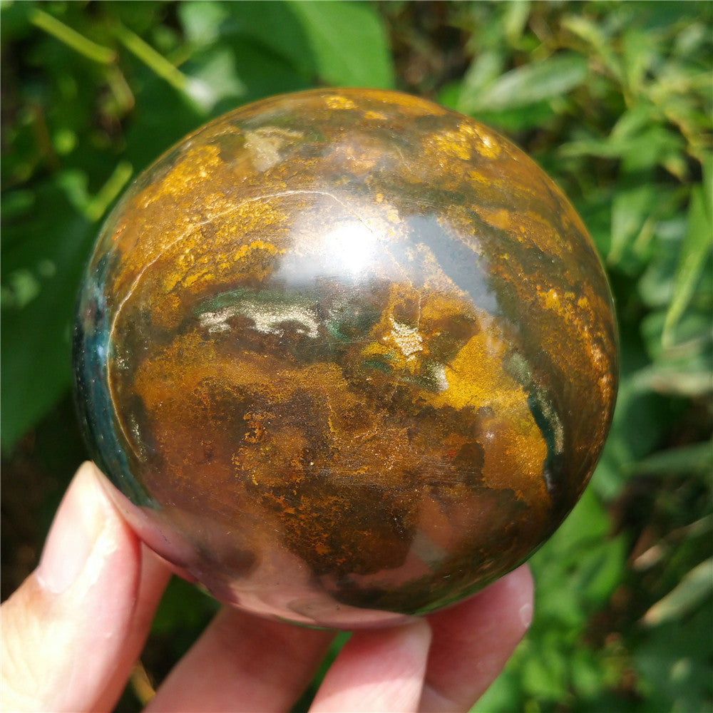 Crystal carved ball of Ocean Jasper