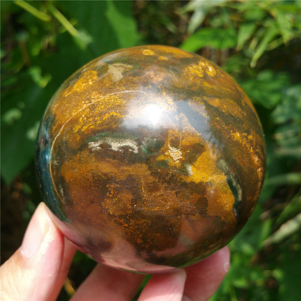 Crystal carved ball of Ocean Jasper
