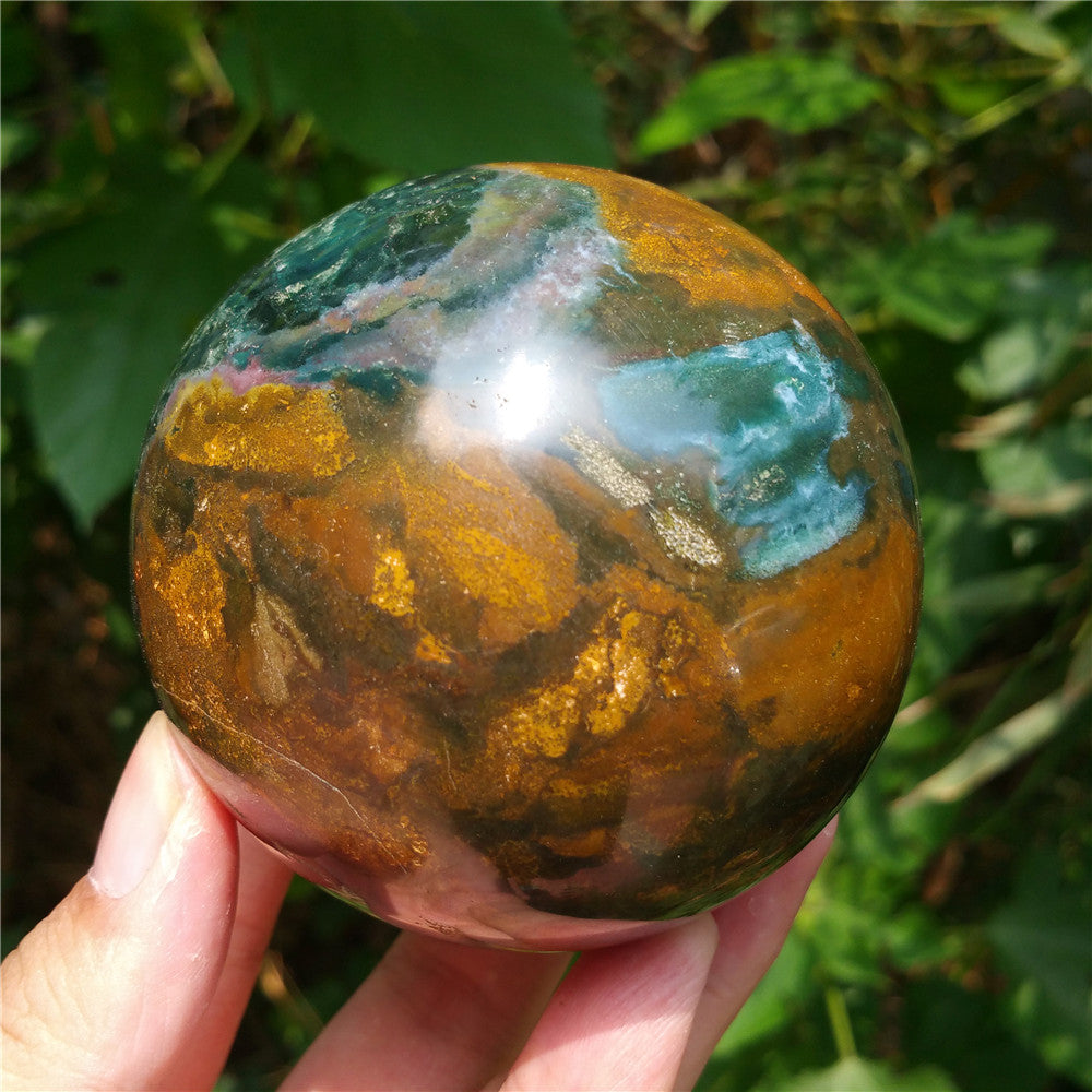 Crystal carved ball of Ocean Jasper