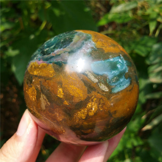 Crystal carved ball of Ocean Jasper