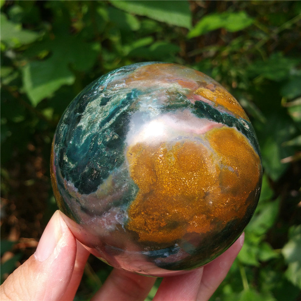 Crystal carved ball of Ocean Jasper