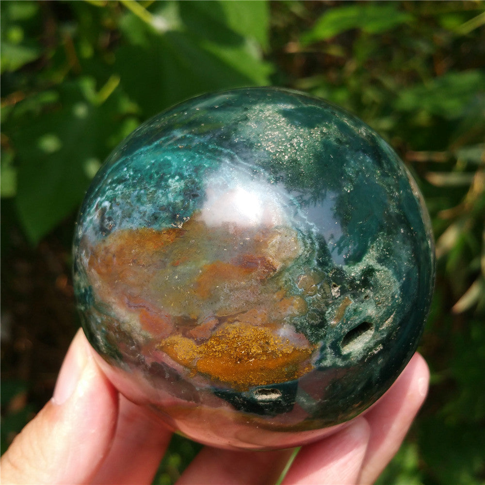 Crystal carved ball of Ocean Jasper