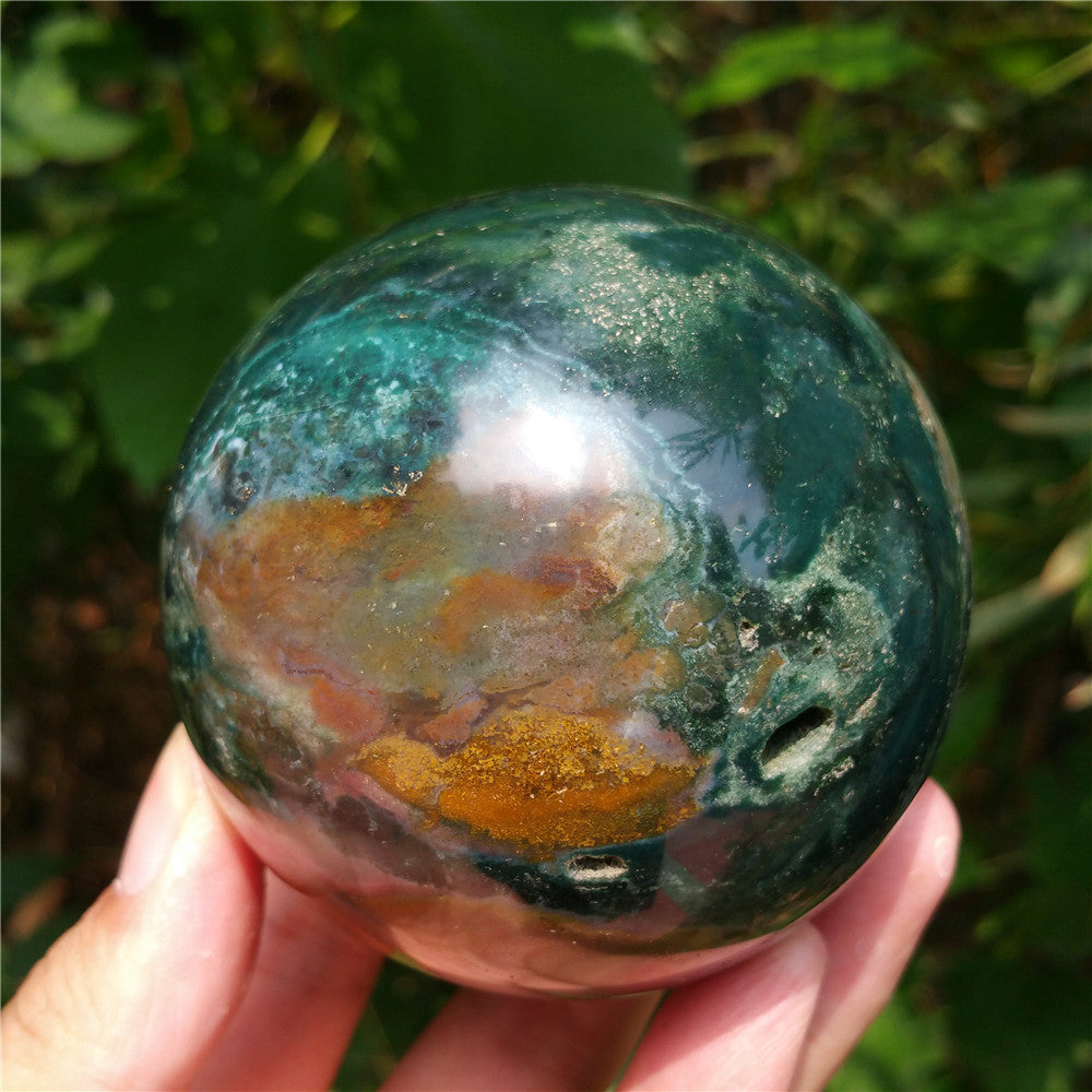 Crystal carved ball of Ocean Jasper