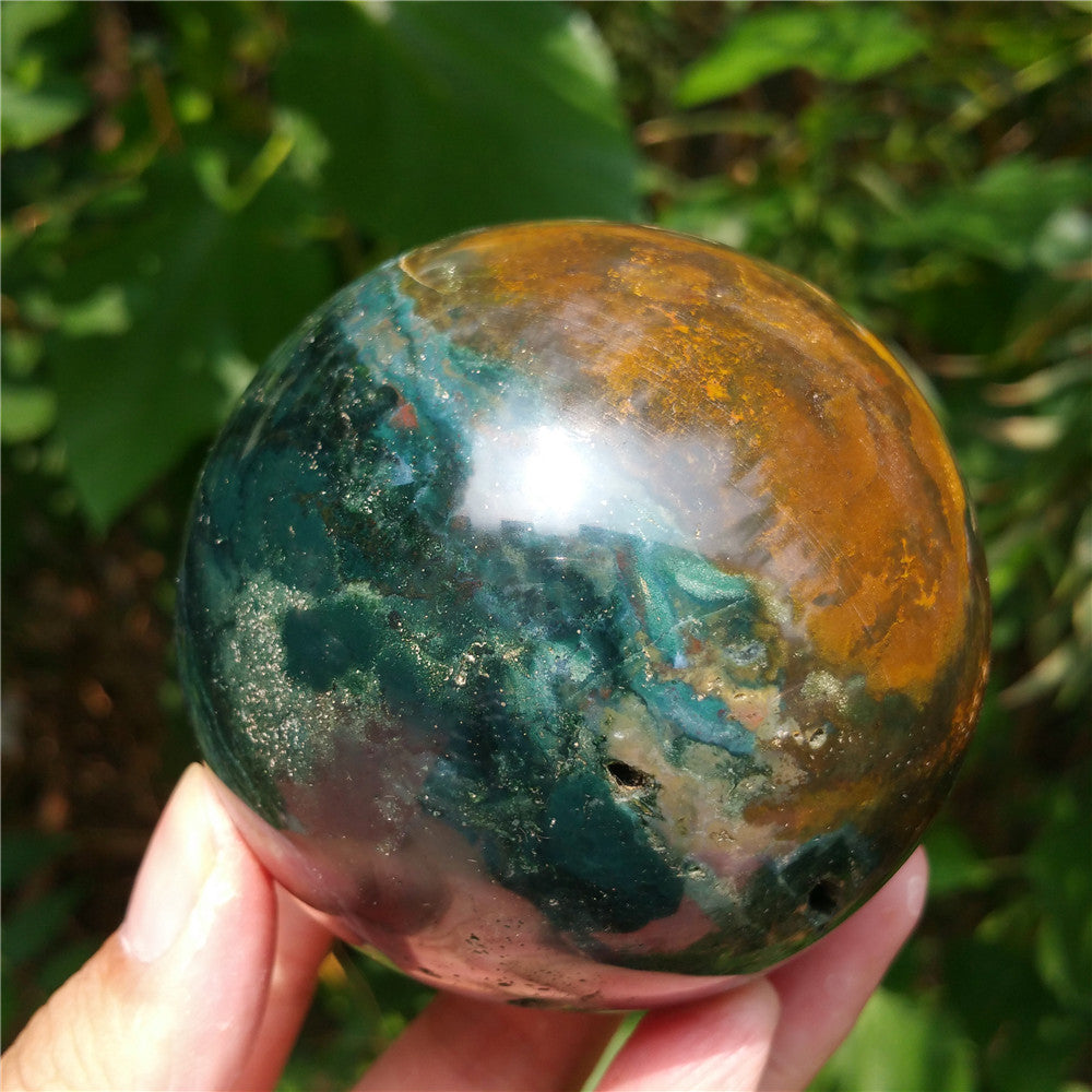 Crystal carved ball of Ocean Jasper