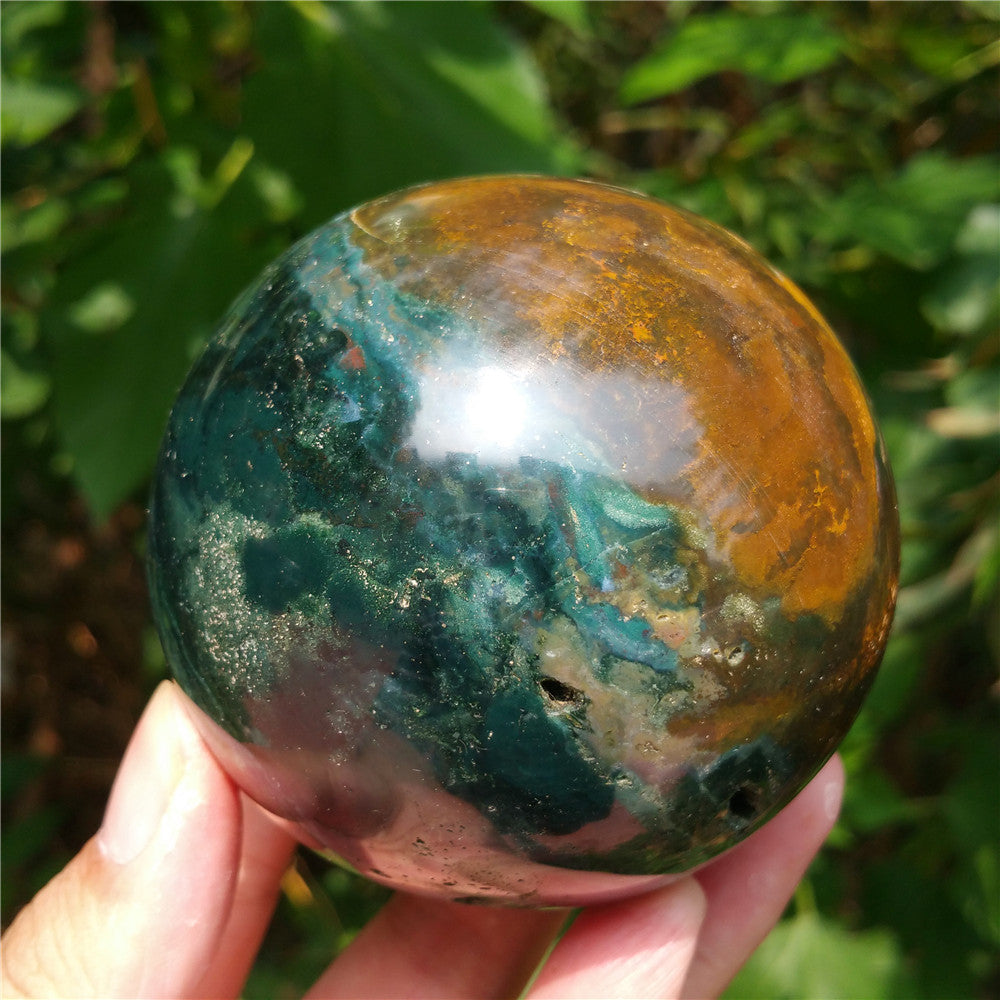 Crystal carved ball of Ocean Jasper