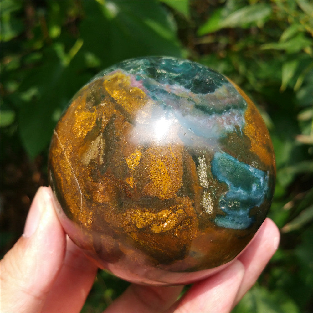 Crystal carved ball of Ocean Jasper