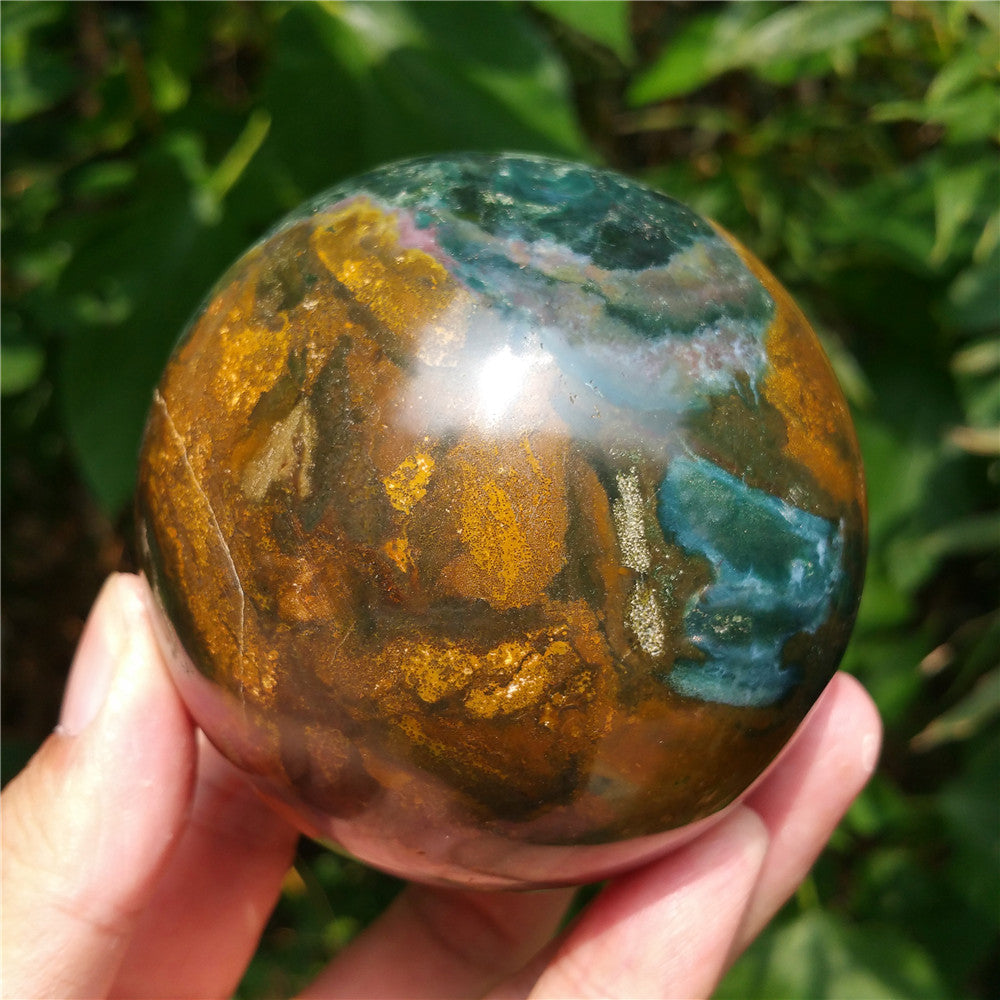Crystal carved ball of Ocean Jasper