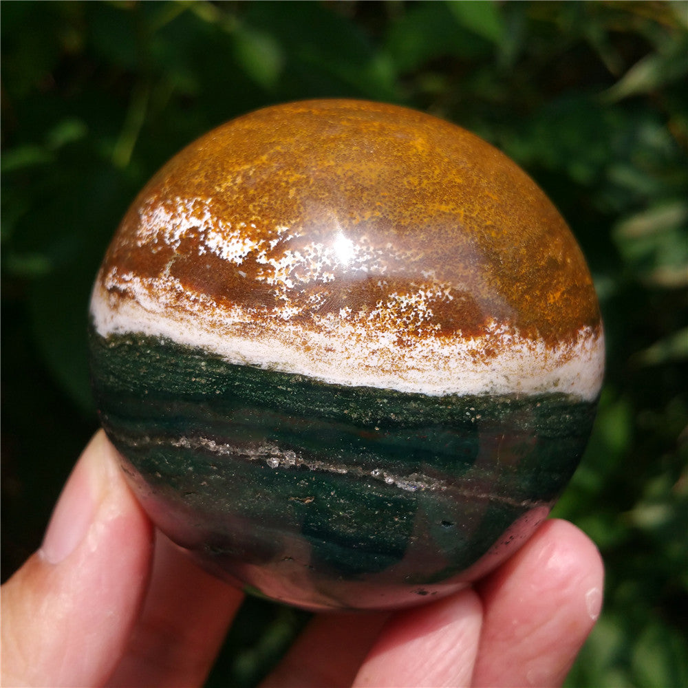 Crystal carved ball of Ocean Jasper
