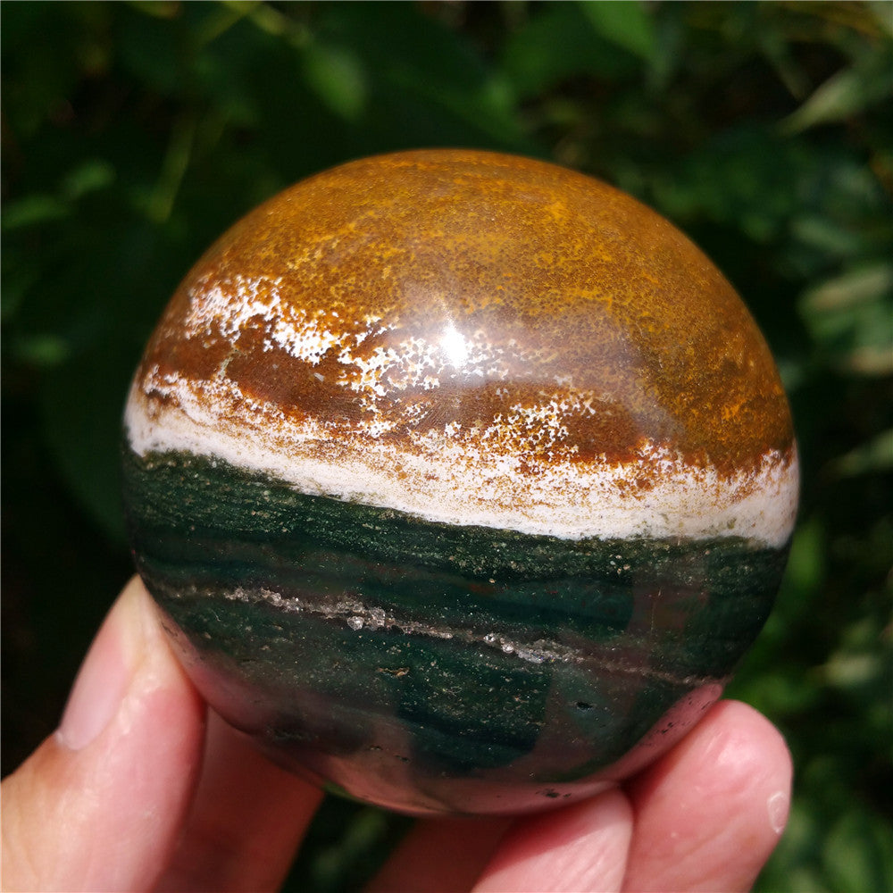 Crystal carved ball of Ocean Jasper