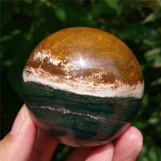 Crystal carved ball of Ocean Jasper