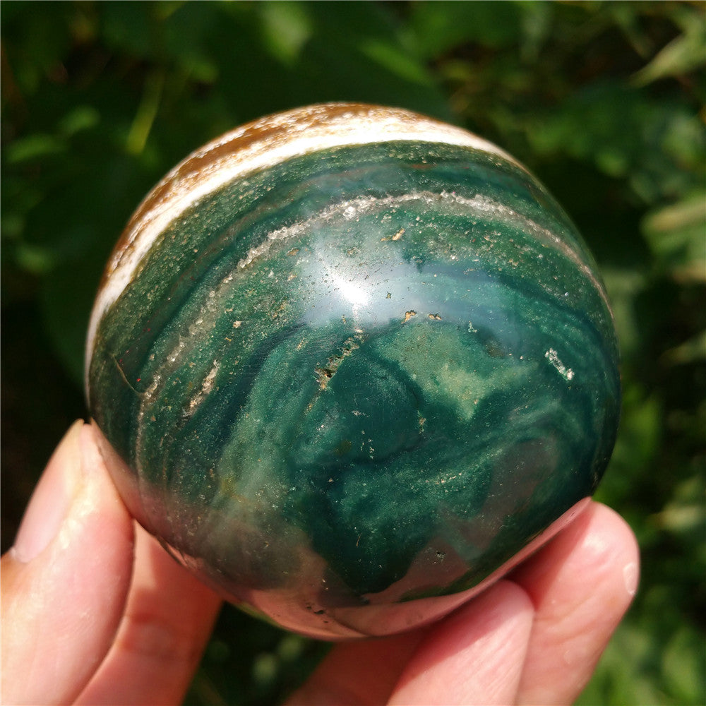 Crystal carved ball of Ocean Jasper