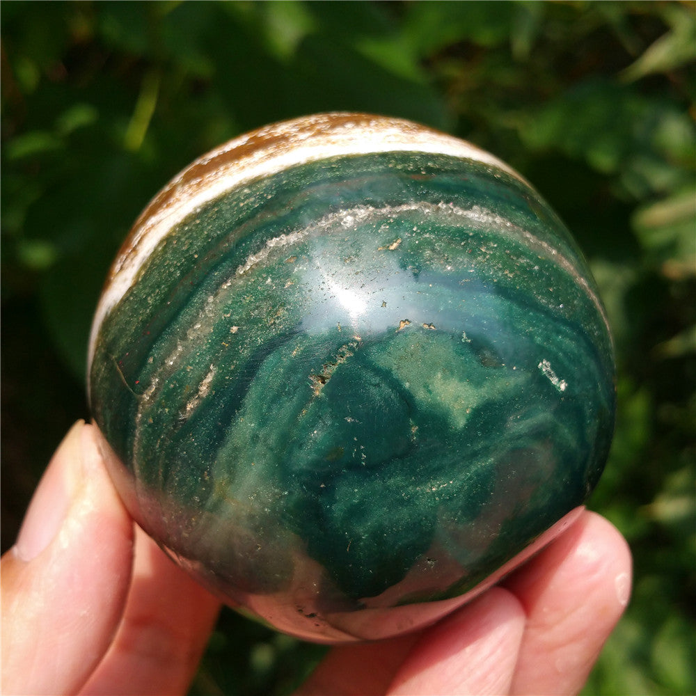 Crystal carved ball of Ocean Jasper