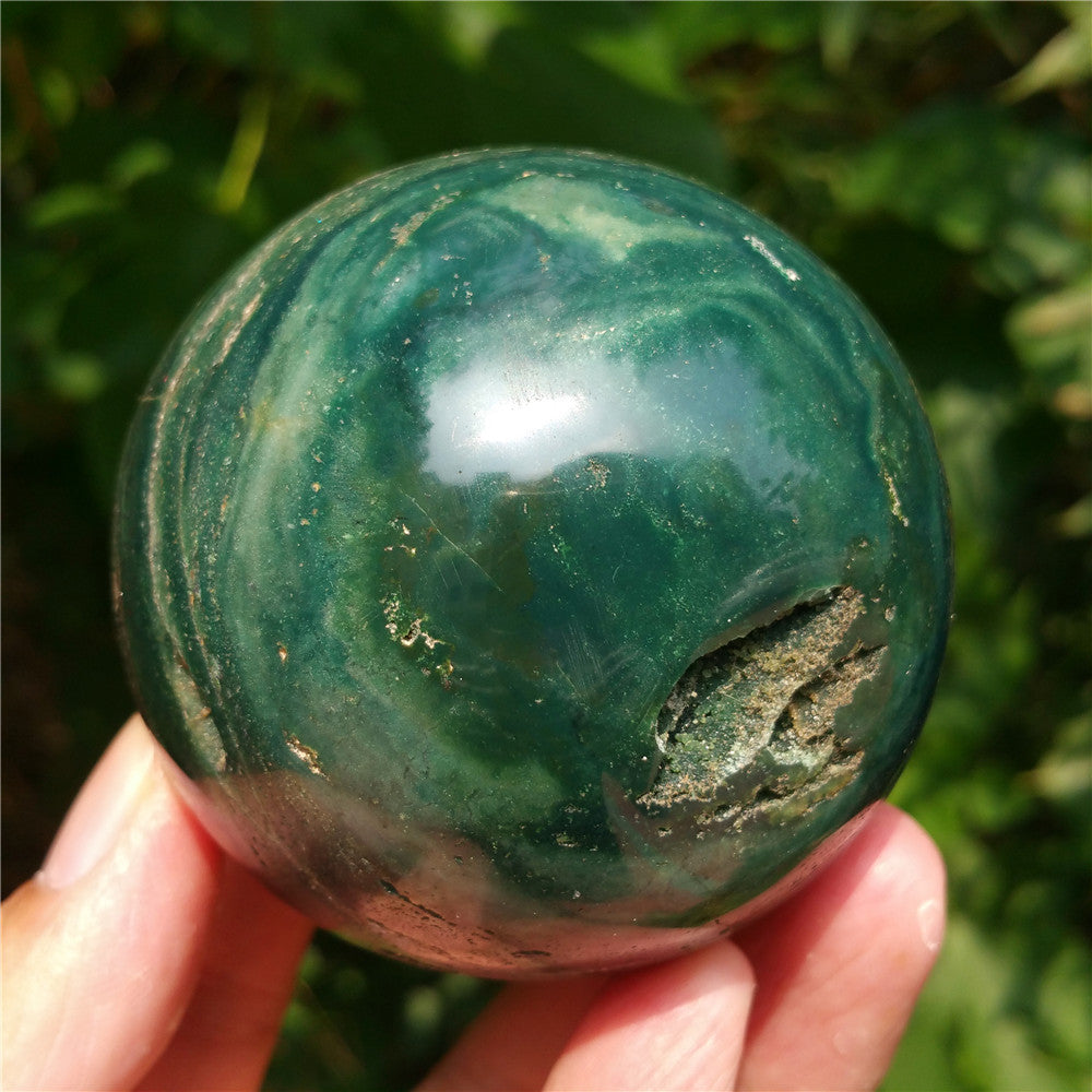 Crystal carved ball of Ocean Jasper