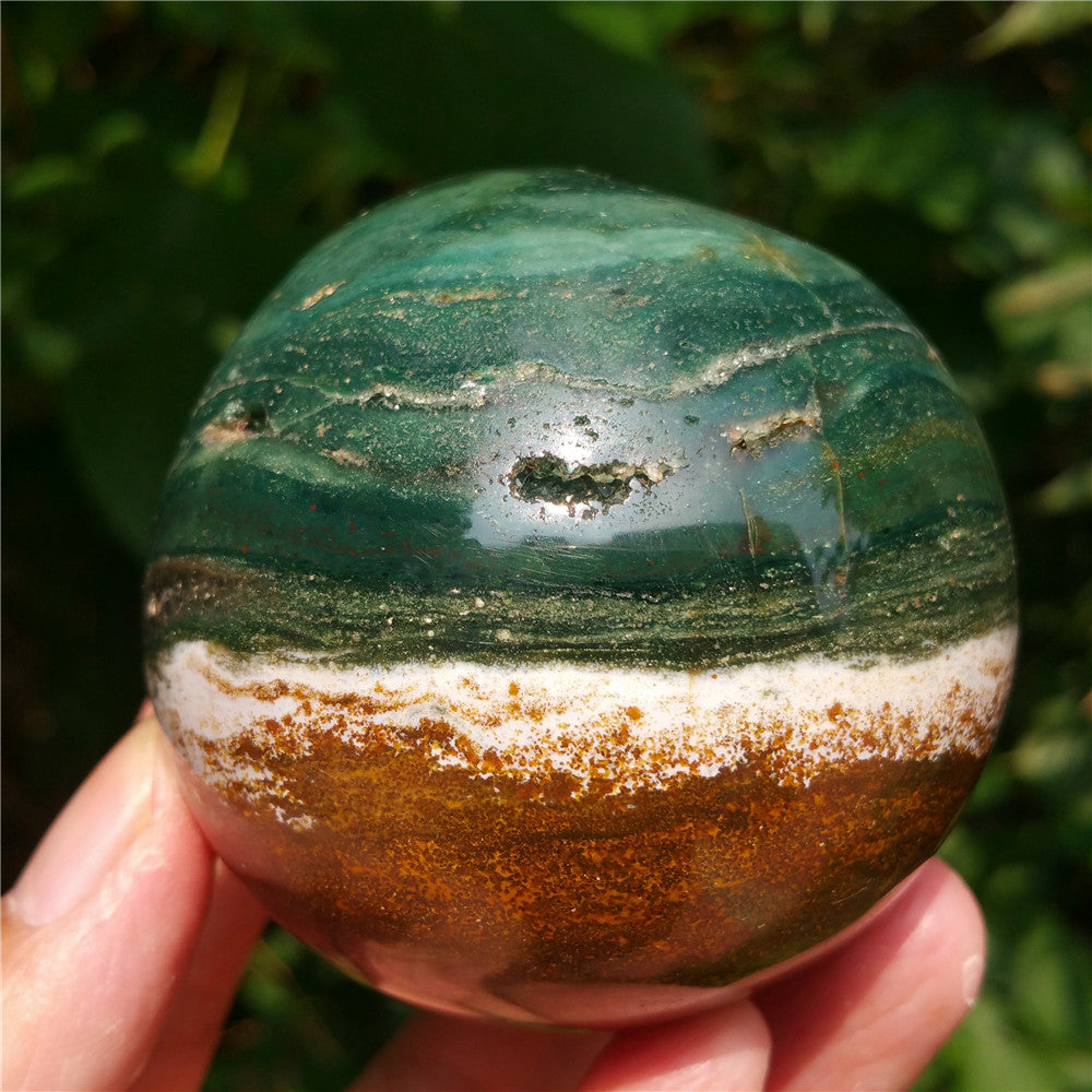 Crystal carved ball of Ocean Jasper