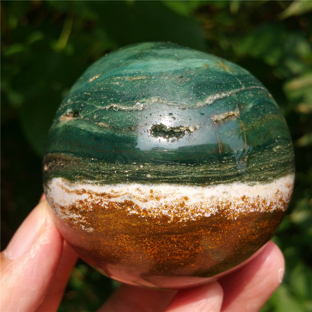 Crystal carved ball of Ocean Jasper