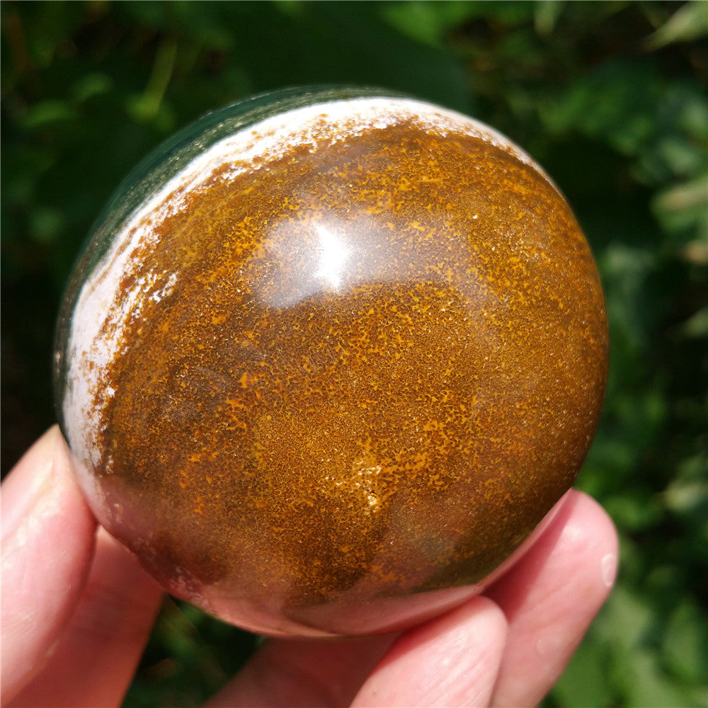 Crystal carved ball of Ocean Jasper