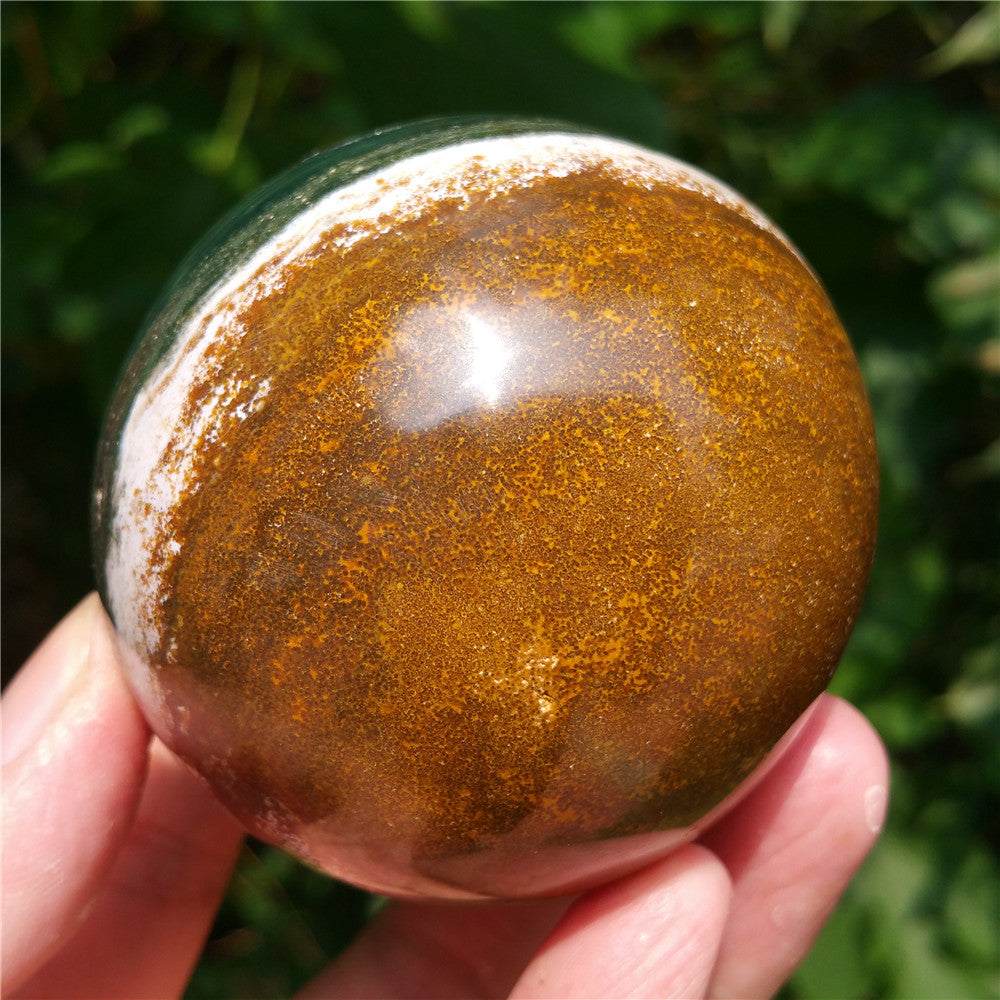 Crystal carved ball of Ocean Jasper