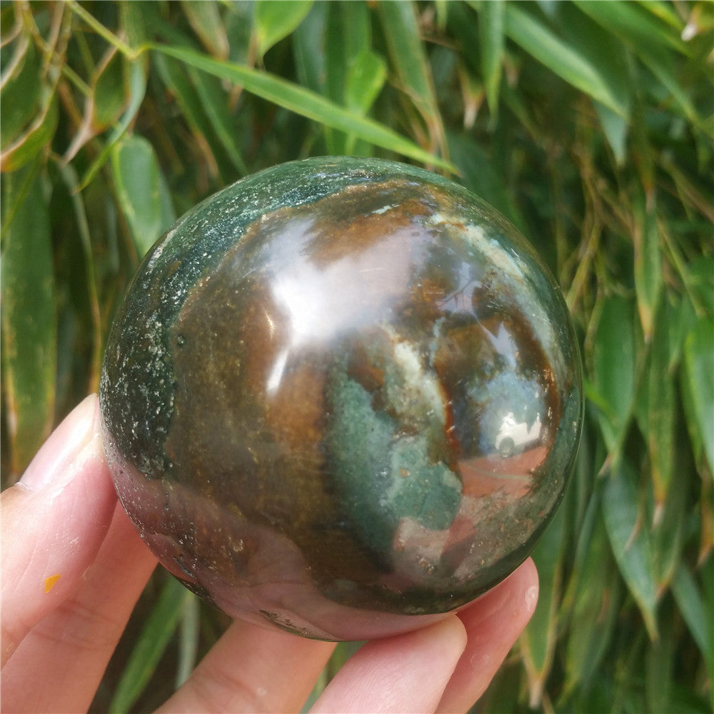 Crystal carved ball of Ocean Jasper